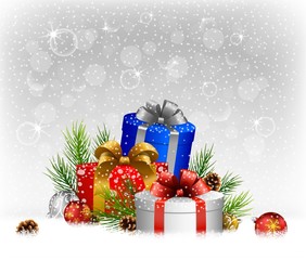 Christmas balls with gift, fir and pine cone on the snow 