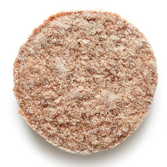 Single frozen hamburger patty isolated on white from above.
