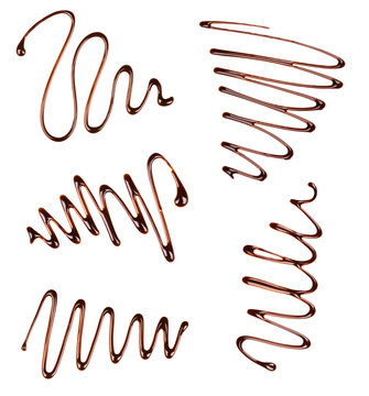 set of abstract symbols made of liquid chocolate isolated on whi