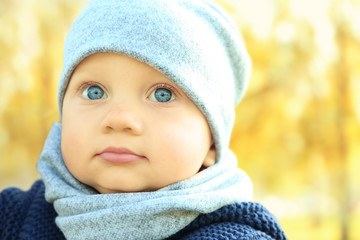 Cute little baby outdoors, close up view