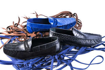 Men's leather loafers (moccasins) isolated on a background of colored laces