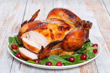 whole grilled chicken cut into slices, close-up