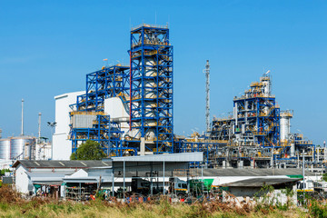 Fototapeta na wymiar Petrochemical plant, oil refinery factory with cloudy sky