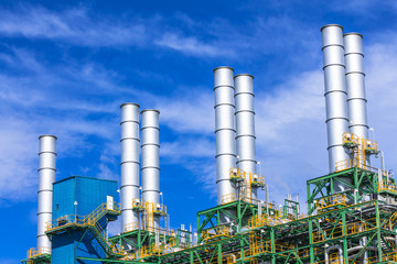 Petrochemical plant, oil refinery factory with cloudy sky