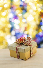 Christmas gift box with colourful bokeh background