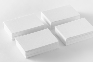 Mockup of business cards stacks at white background.