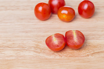 Fototapeta na wymiar Heap of fresh ripe cherry plum tomatoes