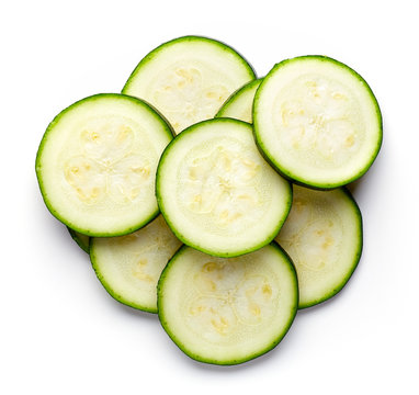 Zucchini slices isolated on white, from above