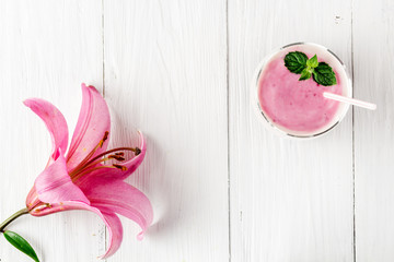 Berry smoothie with yogurt and flower