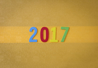 Happy new year 2017 on yellow paper texture background