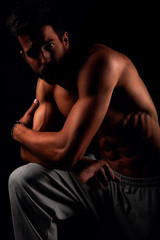 Fototapeta na wymiar Muscular male model posing