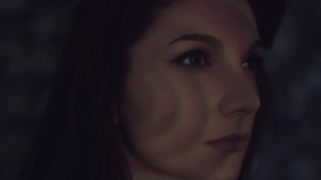 4k Abstract Shot of a Woman Face with Projector Reflection of red Stripes
