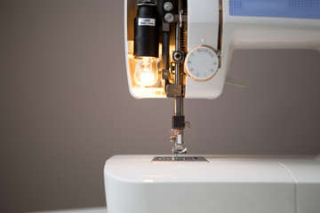 Sewing machine with open lamp