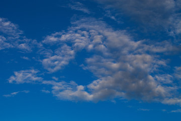 Blue sky with white cumulus clouds