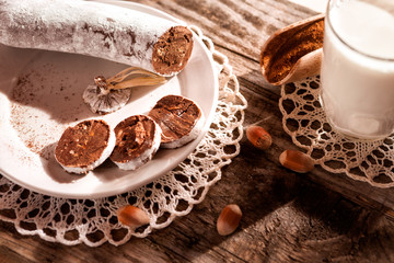 Sliced chocolate sausage on plate