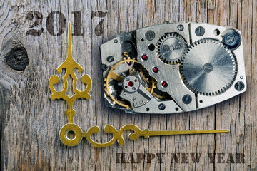 The clock mechanism, Arrows of hours and the New Year