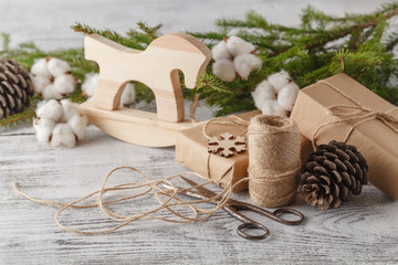 Fototapeta na wymiar Handmade christmas or New Year gifts on wooden background.