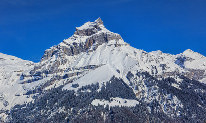 Mount Hahnen in the Swiss Alps, wintertime view from the town of Engelberg