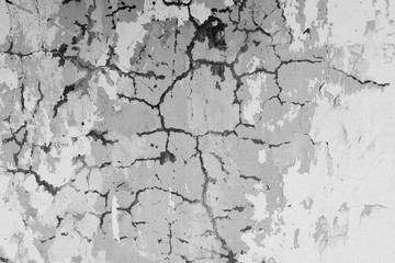 Fototapeta premium Wall fragment with scratches and cracks