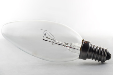 Incandescent light bulb on a white background