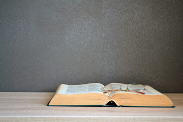 Open Bible with reading glasses