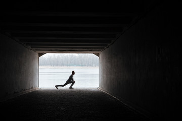 Runner warming up in tunnel