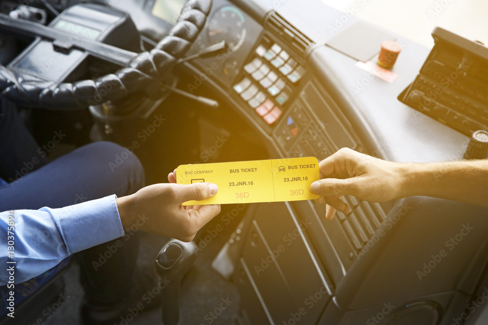 Wall mural bus driver taking ticket from passenger