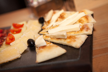 Appetizer with cheese on dough