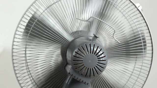 Fan blowing quickly. Air conditioning cools room in hot summer