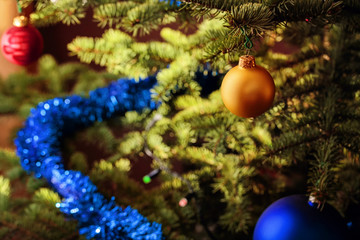 Christmas ball ornaments decoration hanging on Christmas tree. Xmas decorative star.