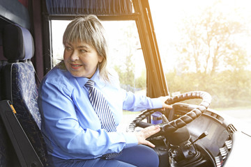 Female driver sitting in bus