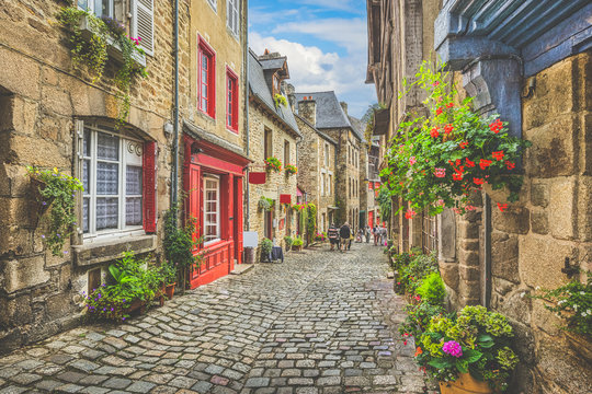 Fototapeta Charming street scene with traditional houses in old town in Europe