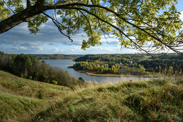 Fototapeta premium autumn landscape with view of the Church and the lake before the rain