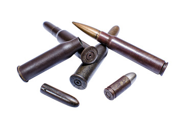 Old shabby cartridges and bullets isolated on white background