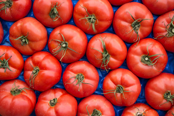 Tomatoes in box as a background.