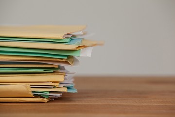 Files on wooden desk