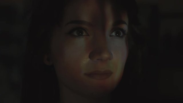 4k Abstract Shot of a Woman Face with Projector Reflection of Fire