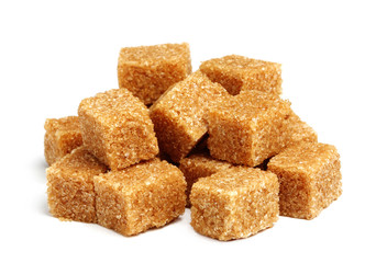 Cane sugar cubes isolated.