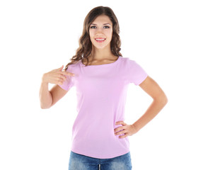 Obraz premium Young woman in blank color t-shirt on white background