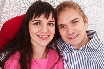 Close-up of married couple embracing while smiling at the camera
