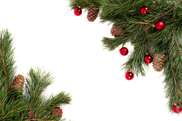 Fototapeta na wymiar Christmas tree with pine cones and red balls