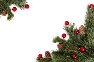 Fototapeta na wymiar Christmas tree with pine cones and red balls