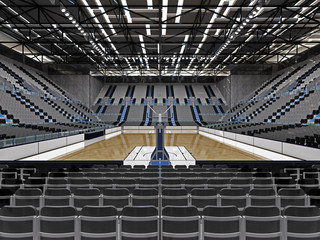 Fototapeta premium Beautiful sport arena for basketball with floodlights and gray seats