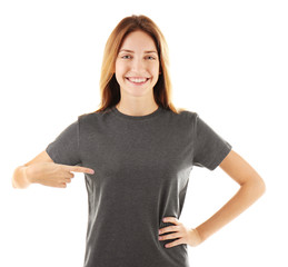 Young woman in blank grey t-shirt on white background