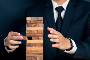 Businessman Builds a Tower