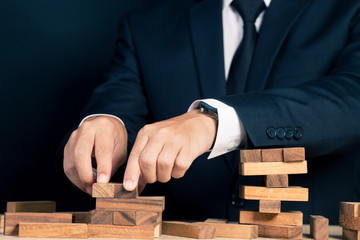 Businessman Builds a Tower