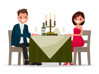 Couple having dinner by candlelight. Man and woman sitting at th