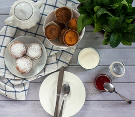 Bright and airy breakfast with muffin, berry jam and milk in glass. Top view, instagram square