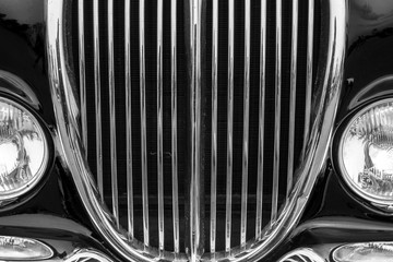 Vintage car detail with black color - chrome grille - obrazy, fototapety, plakaty