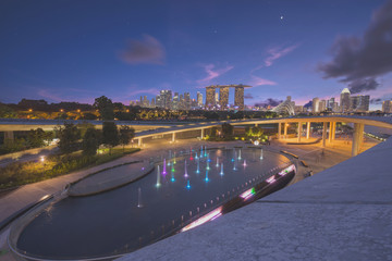 Panorama of Singapore skyline illuminated in the evening twilight..